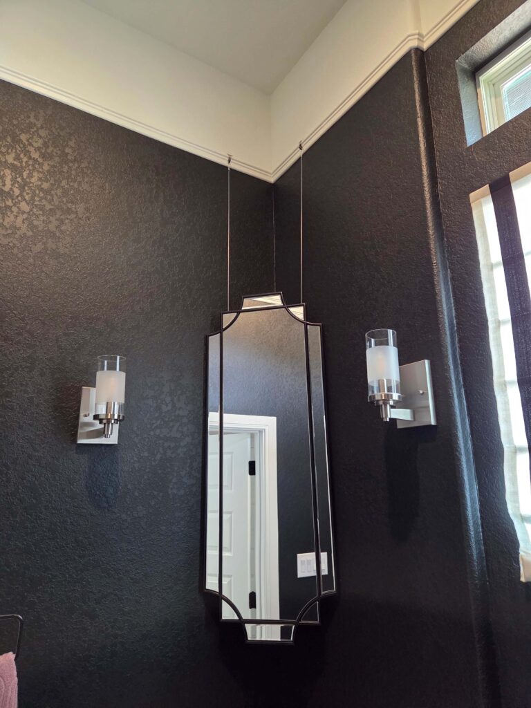 Ways to Hang a Corner Mirror corner mirror hung from wood picture rail trim