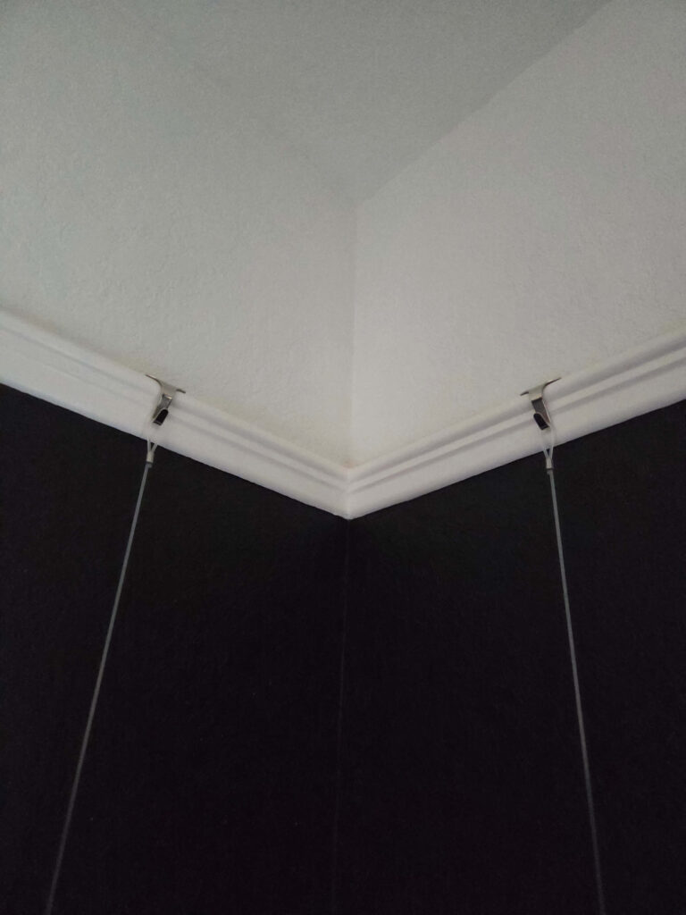 Ways to Hang a Corner Mirror 2 hooks on railing to hang mirror
