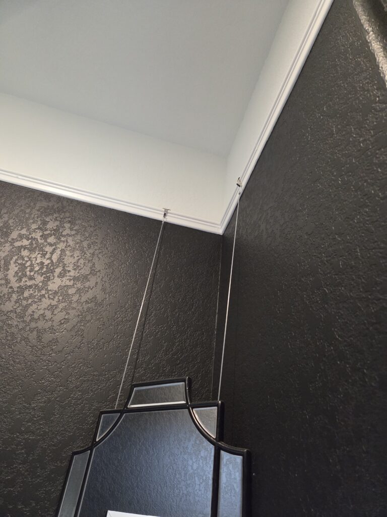 Ways to Hang a Corner Mirror mirror hanging from picture rail system