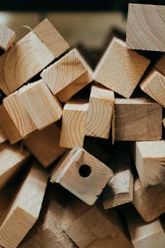 Ways to Hang a Corner Mirror Close-up view of neatly arranged wooden blocks showcasing natural grain patterns and textures.